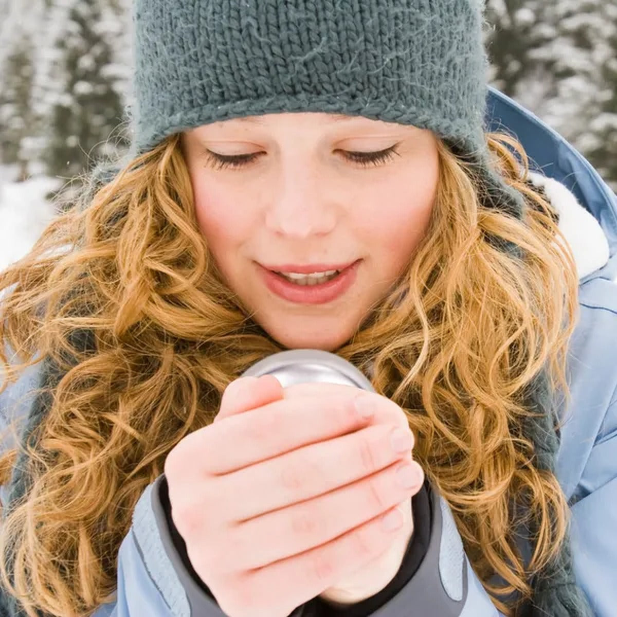 Warming hands with the Rechargeable Hand Warmer outdoors